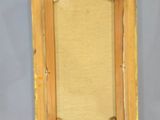 an image of a picture frame with a picture hanging on a wall