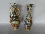 two vases sitting side by side on a table