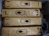 four suitcases in a box with tags on them