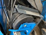 a blue machine that is sitting in the garage
