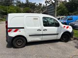a white van that is parked in a parking lot