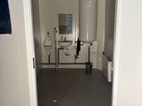 a bathroom with a toilet and a sink in it