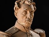 a statue of a man with a pipe in his mouth