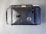 a black camera sitting on top of a table