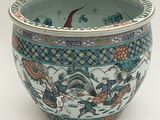 a blue and white bowl with a design on it