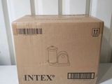 boxed box on a white table with a white chair in the background