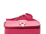 a pink purse with a gold handle on a white background