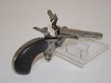 a small gun that is sitting on a table