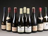 six bottles of wine are lined up in a row