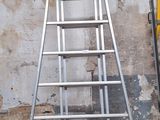 a ladder that is leaning against a wall