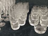a lot of empty wine glasses on the table