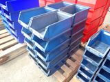 many blue and red bins stacked on a pallet