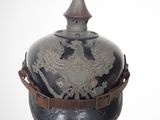 a military helmet with a decorative decoration on it