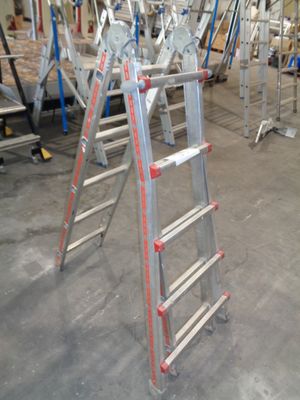 many ladders that are sitting in a room