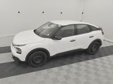the white car is parked in the garage on the checkered floor