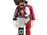 figurine en céramique représentant un homme vêtu d'un costume coloré et tenant un livre
