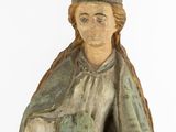 a statue of a woman holding a baby in her arms