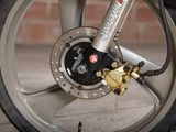 a close up view of a motorcycle wheel with a brake