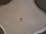 a white plate that has a black and white design on it