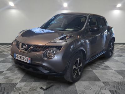 a silver nissan juke parked on a checkered floor