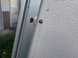 a small hole in the side of a building that has a small hole in it