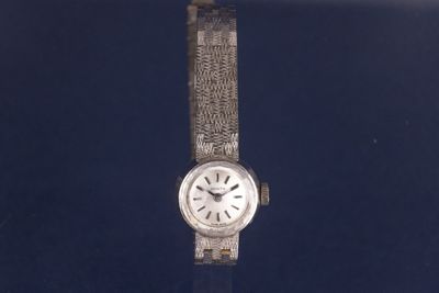 an image of a wrist watch on display in a glass case