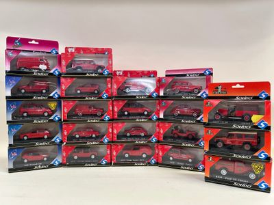 a lot of red toy cars that are on display