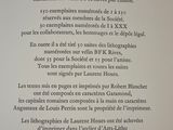 a poem written in french on the wall of a building