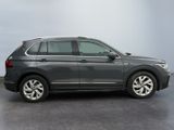 the volkswagen tiguan is parked in a parking lot