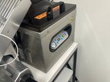 a machine that is sitting on a counter in a kitchen