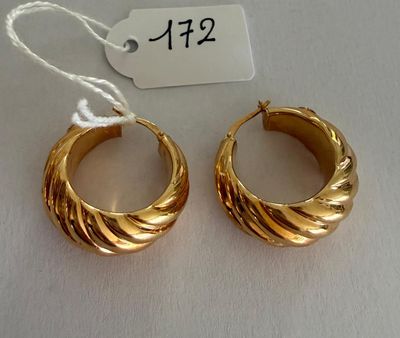 pair of gold toned hoop earrings on white background with price tag