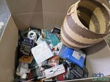 a cardboard box filled with assorted items in it