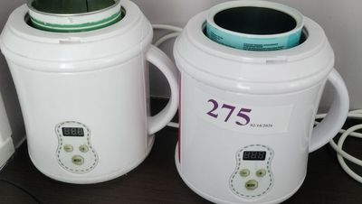 two blenders sitting next to each other on a table