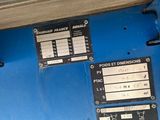 a close up of a blue machine with a lot of buttons on it