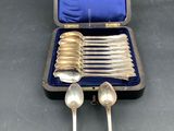 silverware in a case with spoons and spoons in it