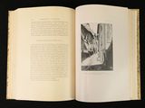 an open book with a picture of a man walking down the street