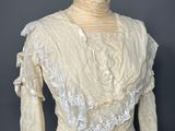 a woman ' s white blouse on a mannequin mannequin mannequin mannequin mannequin mannequin mannequin mannequin