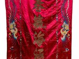 a red and gold silk embroidered wall hanging with chinese characters