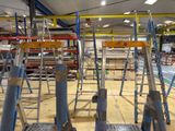 many ladders that are sitting in a room