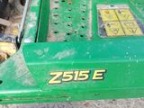a close up of a green tractor with the number 25 on it