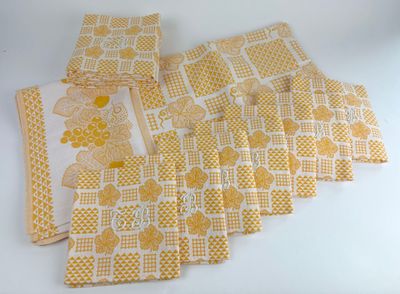 six yellow and white napkins with yellow flowers on them