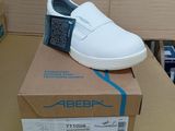 a box with a pair of white shoes on top of it