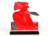 a red and black sculpture of a woman holding a tennis racquet