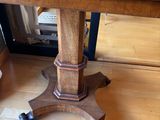 a wooden table with a wooden top on a hard wood floor