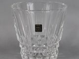 the glass is clear and has a black label on it