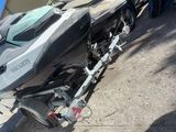 a black and silver jet ski parked on the side of the road