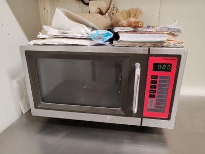 a microwave sitting on top of a counter in a kitchen