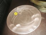 a plastic bowl that has a yellow sticker on it