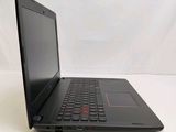 a black laptop computer sitting on a white surface
