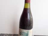 a bottle of wine that is sitting on a table